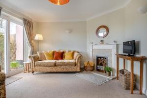 a living room with a couch and a fireplace at 2 Bed in Halesworth oc-rect in Halesworth