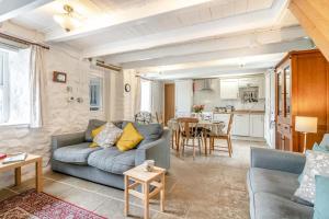 a living room with a couch and a table at 2 Bed in Swansea oc-hh403 in Llanmadoc