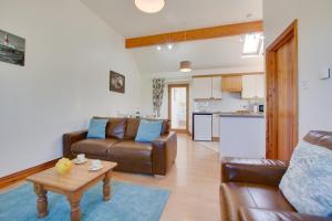 a living room with a couch and a table at 2 Bed in Roughton oc-1734 in Roughton