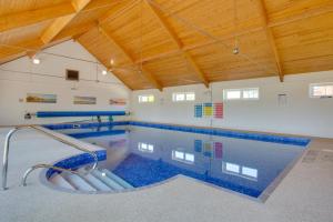 a large swimming pool in a building with a ceiling at 2 Bed in Roughton oc-1734 in Roughton
