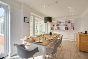 a dining room with a long table and chairs at 5 Bed in Mundesley oc-2189 in Mundesley