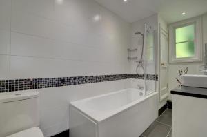 a white bathroom with a tub and a sink at 4 Bed in Lynmouth oc-marins in Barbrook +42 photos