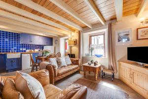 a living room with a couch and a table at 2 Bed in St Just oc-crownm in St. Just