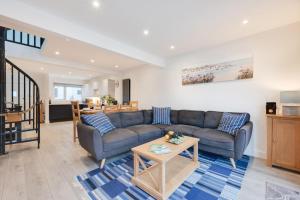 a living room with a couch and a table at 3 Bed in Looe oc-l30071 in Looe