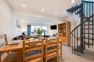 a dining room with a wooden table and chairs at 3 Bed in Looe oc-l30071 in Looe