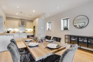 a kitchen and dining room with a table and chairs at 2 Bed in Windermere oc-gl064 in Windermere