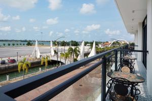 a balcony with a view of a parking lot at ALVILLA Kampung Cina in Kuala Terengganu