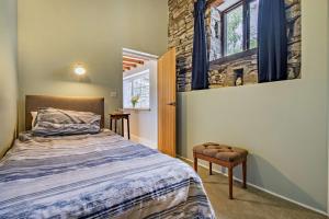 a bedroom with a bed and a window at 3 Bed in Cemmaes Road oc-h29101 in Cemmaes