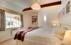 a bedroom with a bed and a window at 2 Bed in Bamburgh oc-gd0248 in Bamburgh