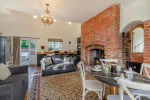 a living room with a brick wall at 3 Bed in Bessingham oc-b28837 in Thurgarton