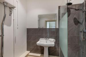 a bathroom with a sink and a shower at 3 Bed in Bessingham oc-b28837 in Thurgarton