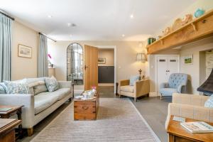 a living room with a couch and a table at 3 Bed in Withypool oc-o18550 in Withypool
