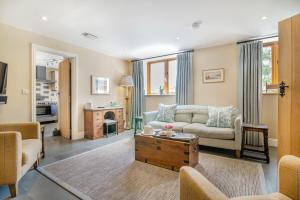 a living room with a couch and a table at 3 Bed in Withypool oc-o18550 in Withypool
