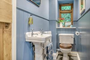 a bathroom with a sink and a toilet at 3 Bed in Withypool oc-o18550 in Withypool +29 photos
