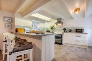 a kitchen with a large island in the middle at 2 Bed in St. Teath oc-shilli in Saint Teath