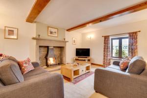a living room with two couches and a fireplace at 3 Bed in Carperby oc-ds1033 in Carperby