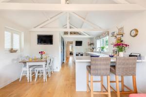 a kitchen and dining room with a table and chairs at 2 Bed in Holt oc-2027 in Thornage