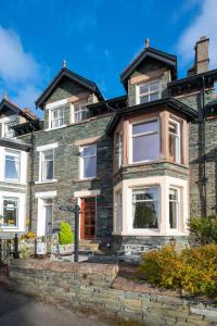 a large brick house with white windows at 6 Bed in Keswick oc-ld177 in Keswick