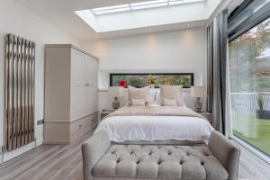 a bedroom with a large bed and a window at 5 Bed in St. Fillans oc-t30058 in Saint Fillans +35 photos