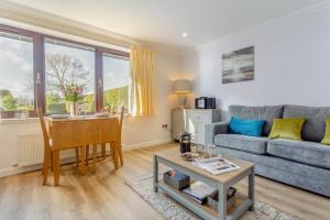 a living room with a couch and a table at 2 Bed in Insch oc-t30986 in Colpy