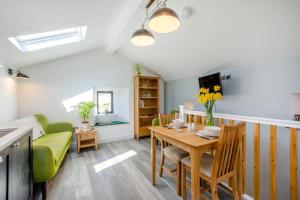 a living room with a table and a couch at 1 Bed in Austwick oc-b31906 in Horton in Ribblesdale