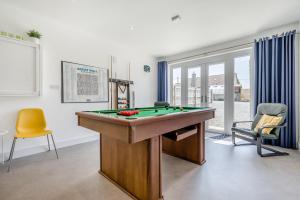 a room with a pool table in a room with at 5 Bed in Bradworthy oc-d31987 in Bradworthy