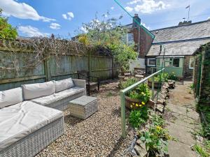 a backyard with a couch and a fence at 1 Bed in Corbridge oc-t31977 in Corbridge