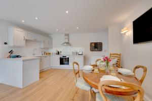 a kitchen and dining room with a table and chairs at 2 Bed in Beccles oc-rilo in Beccles +21 photos