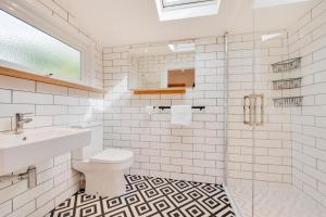 a white bathroom with a sink and a toilet at 2 Bed in Aberaeron oc-bow329 in Aberaeron +10 photos