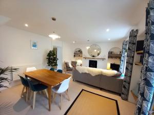 a living room with a table and a couch at 2 Bed in Aberaeron oc-bow329 in Aberaeron