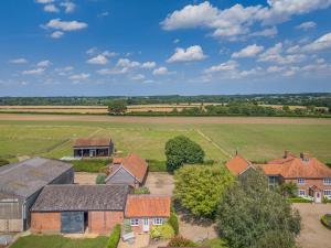 an aerial view of a village with houses and a field at 1 Bed in Swannington oc-1011 in Alderford