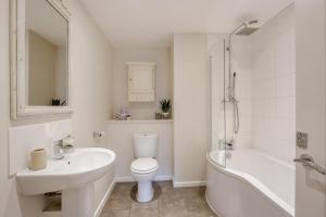 a white bathroom with a sink and a toilet and a tub at 3 Bed in Staplecross oc-rh1162 in Sedlescombe +15 photos