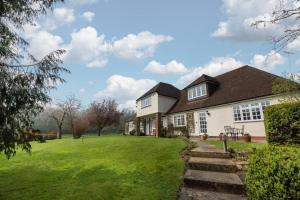 a house with a green lawn in front of it at 1 Bed in Tenterden oc-tn623 in Saint Michaels