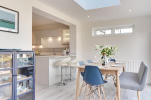 a kitchen and dining room with a table and chairs at 3 Bed in Greatstone oc-ek777 in Littlestone-on-Sea