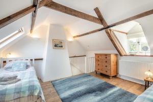 a bedroom with white walls and wooden beams at 2 Bed in East Runton oc-2034 in West Runton
