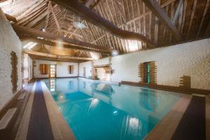 a large swimming pool in a building at 2 Bed in Bacton oc-712 in Bacton