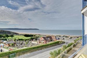 a view from the balcony of a beachfront house at 3 Bed in Woolacombe oc-5byron in Woolacombe