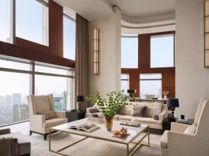 a living room with a couch and a table at The Langham, Shanghai, Xintiandi in Shanghai