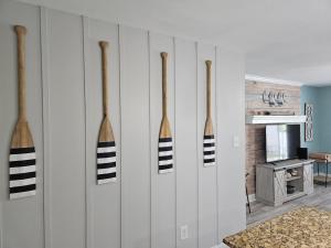 a wall with four wooden bats hanging on it at Seaside Gem in Biloxi