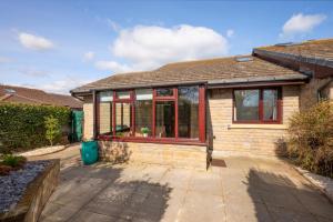 a house with glass windows on the side of it at 2 Bed in Seahouses oc-nb1974 in North Sunderland