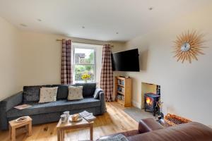 a living room with a couch and a fire place at 4 Bed in Gayle oc-ds950 in Hawes