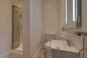 a bathroom with a toilet and a sink and a shower at 4 Bed in Gayle oc-ds950 in Hawes +20 photos