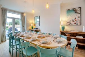 a dining room with a large table and chairs at 6 Bed in Abersoch oc-c29569 in Abersoch