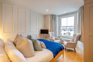 a bedroom with a white couch and a window at 6 Bed in Abersoch oc-c29569 in Abersoch