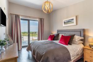 a bedroom with a large bed and a balcony at 3 Bed in Hartland oc-w29797 in Hartland