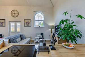 a living room with a couch and a table at 1 Bed in Kinsham oc-t30051 in Kinsham +16 photos