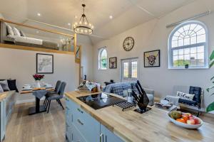 a kitchen and living room with a couch and a table at 1 Bed in Kinsham oc-t30051 in Kinsham