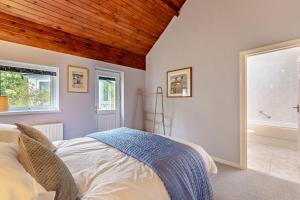 a bedroom with a bed with a wooden ceiling at 3 Bed in Loweswater oc-w30224 in Loweswater