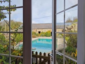 a view of a swimming pool from a window at 3 Bed in Chale oc-s30298 in Chale