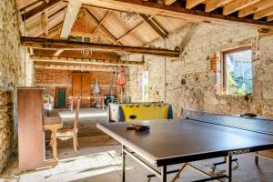 a ping pong table in the middle of a room at 3 Bed in Chale oc-s30298 in Chale